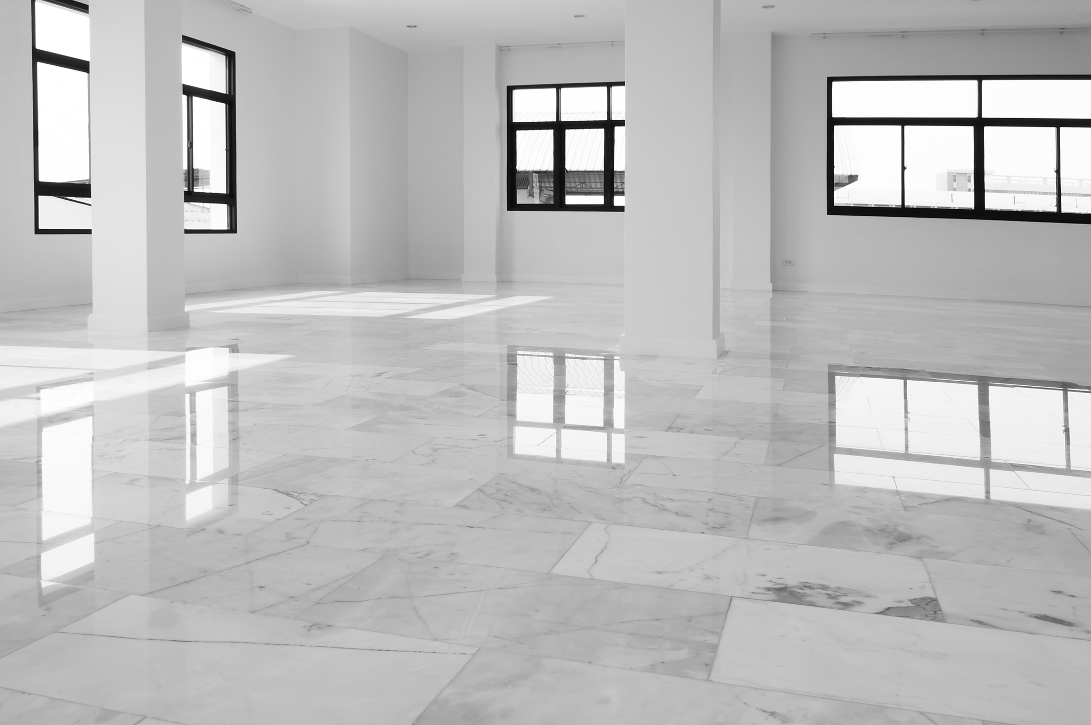 Interior of empty apartment, wide room with marble floor